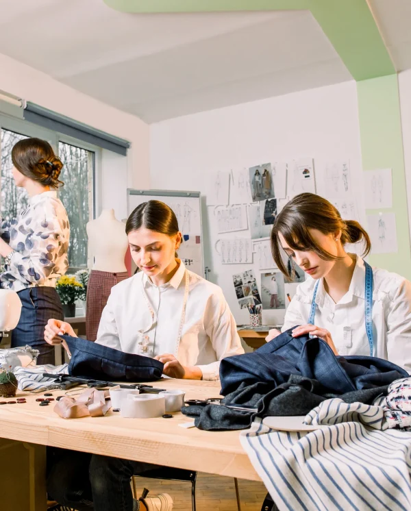 female-fashion-designer-standing-near-clothing-rac-2024-12-13-11-44-24-utc